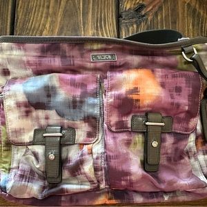 Tumi Crossbody Multicolor grey strap. Excellent condition!